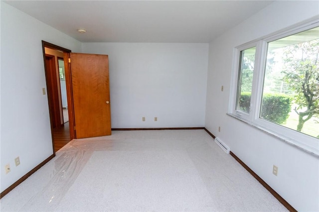 240 Connellsville St, Dunbar, PA 15431 - spare room with light carpet, baseboard heating, baseboards, and a smoke detector