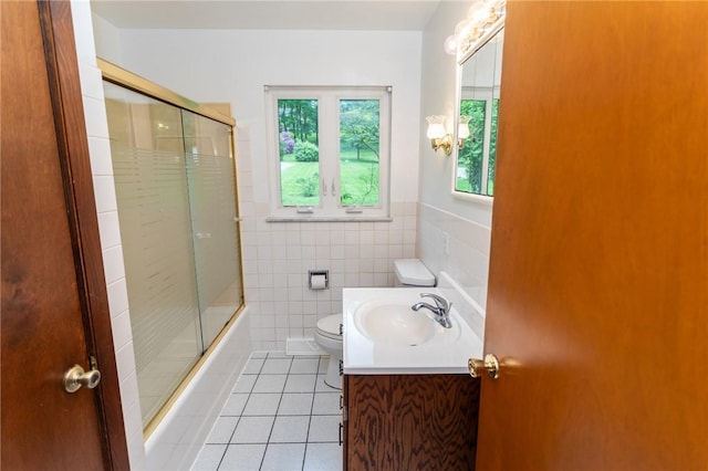 240 Connellsville St, Dunbar, PA 15431 - full bathroom featuring tile patterned flooring, toilet, vanity, enclosed tub / shower combo, and tile walls