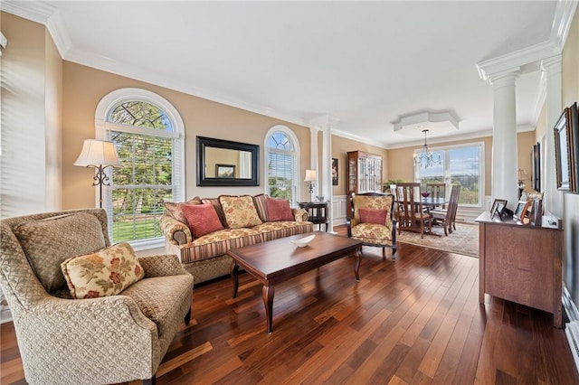 805 Saddleback Ct, Hempfield Twp Wml, PA 15601 - living room featuring ornate columns, dark wood-style floors, ornamental molding, and a chandelier