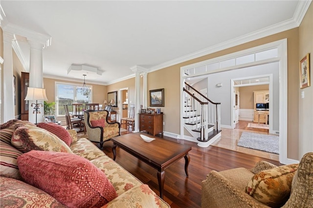 805 Saddleback Ct, Hempfield Twp Wml, PA 15601 - living area with ornate columns, crown molding, wood finished floors, stairs, and baseboards
