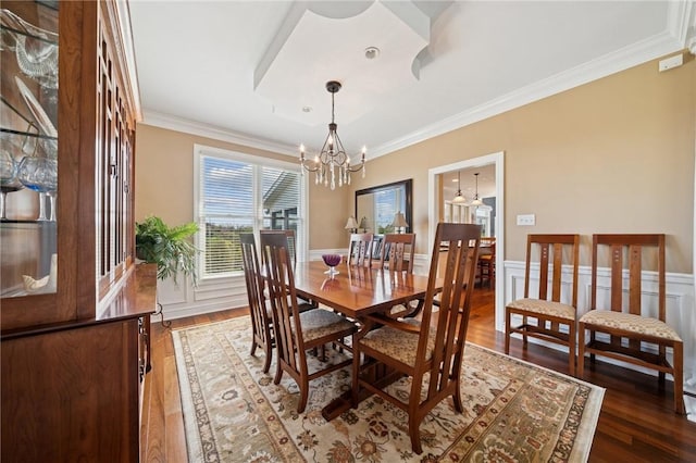 805 Saddleback Ct, Hempfield Twp Wml, PA 15601 - dining room with crown molding, a wainscoted wall, wood finished floors, and a chandelier