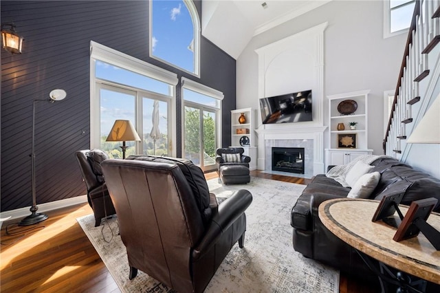 805 Saddleback Ct, Hempfield Twp Wml, PA 15601 - living area featuring high vaulted ceiling, wood finished floors, a fireplace, and stairway