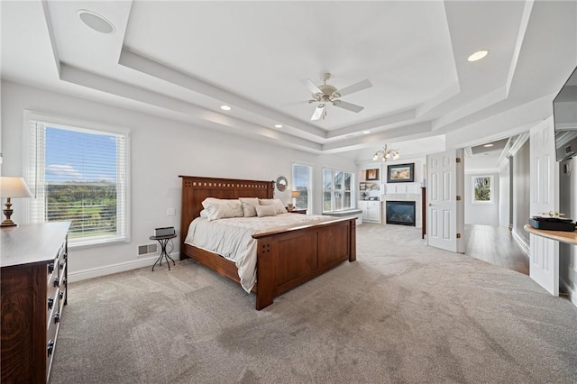 805 Saddleback Ct, Hempfield Twp Wml, PA 15601 - bedroom featuring a tray ceiling, light colored carpet, multiple windows, and recessed lighting