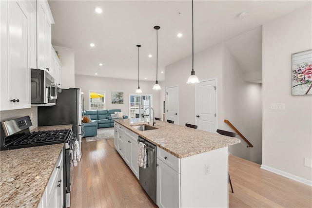 1001 Mohawk Ln, Marshall, PA 16046 - kitchen featuring appliances with stainless steel finishes, a sink, light wood-type flooring, white cabinetry, and recessed lighting