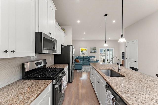 1001 Mohawk Ln, Marshall, PA 16046 - kitchen featuring stainless steel appliances, a sink, white cabinets, wood finished floors, and recessed lighting
