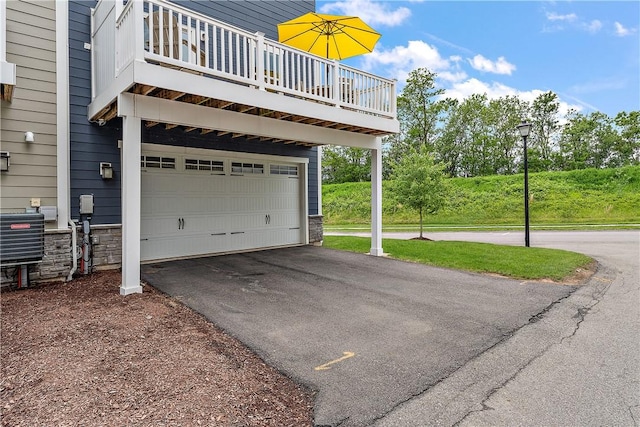 1001 Mohawk Ln, Marshall, PA 16046 - garage featuring asphalt driveway and central air condition unit