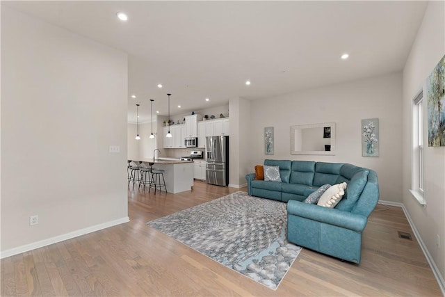 1001 Mohawk Ln, Marshall, PA 16046 - living room featuring light wood-type flooring, baseboards, and recessed lighting