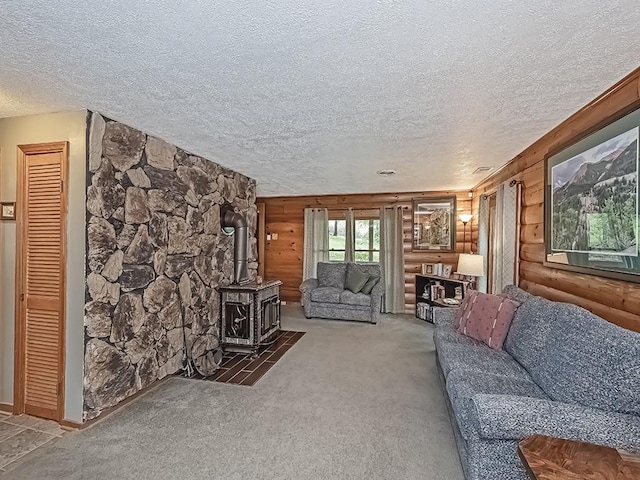 1646 Millers Run Rd, Mount Pleasant Twp Was, PA 15057 - carpeted living area featuring a wood stove, a textured ceiling, and rustic walls