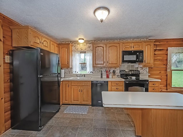 1646 Millers Run Rd, Mount Pleasant Twp Was, PA 15057 - kitchen with black appliances, a textured ceiling, a sink, and light countertops