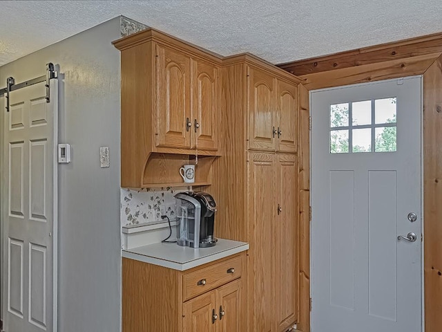1646 Millers Run Rd, Mount Pleasant Twp Was, PA 15057 - kitchen with a textured ceiling, light countertops, and a barn door