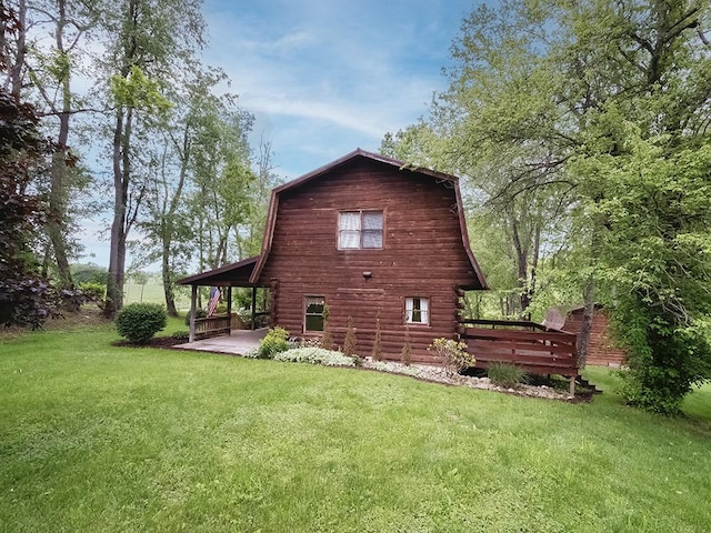 1646 Millers Run Rd, Mount Pleasant Twp Was, PA 15057 - rear view of house featuring a gambrel roof, a yard, a wooden deck, and log exterior