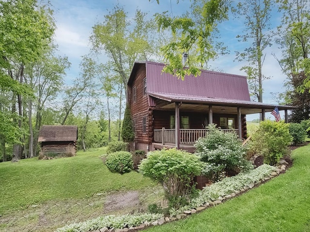 1646 Millers Run Rd, Mount Pleasant Twp Was, PA 15057 - view of front facade featuring log siding, a front yard, and metal roof
