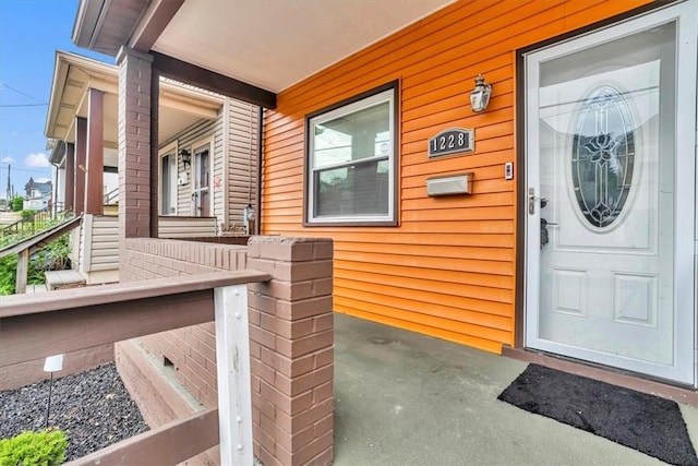 1228 Soles St, Mckeesport, PA 15132 - property entrance featuring a porch