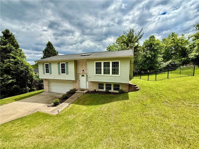 1386 Riddle Ave, Morgantown, WV 26505 - raised ranch featuring concrete driveway, a garage, and brick siding