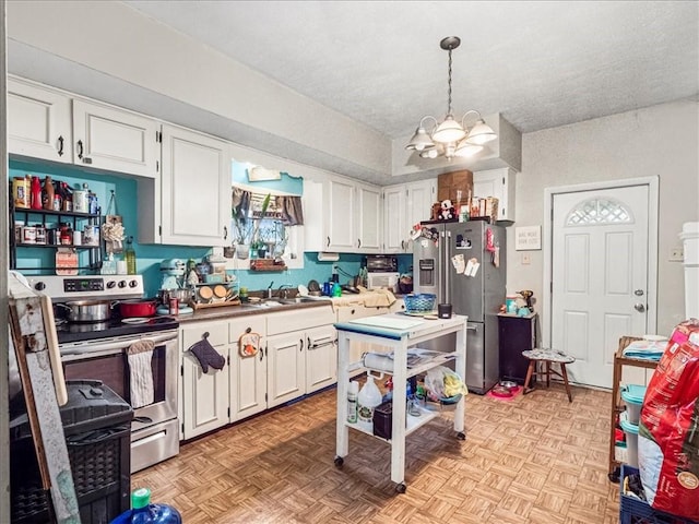 7641 Big Beaver Blvd, Big Beaver, PA 16157 - kitchen featuring stainless steel appliances, a chandelier, white cabinets, a sink, and hanging light fixtures