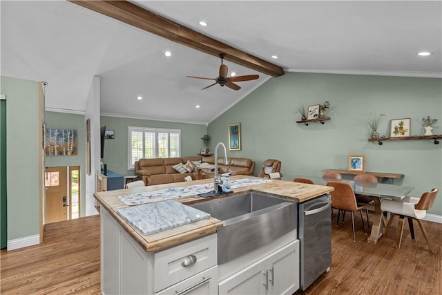 22 Green Crescent Dr, South Strabane, PA 15301 - kitchen featuring a sink, stainless steel dishwasher, light wood-style floors, white cabinetry, and open floor plan
