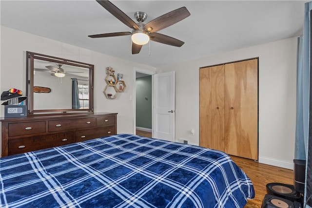 22 Green Crescent Dr, South Strabane, PA 15301 - bedroom featuring wood finished floors, a ceiling fan, baseboards, and a closet