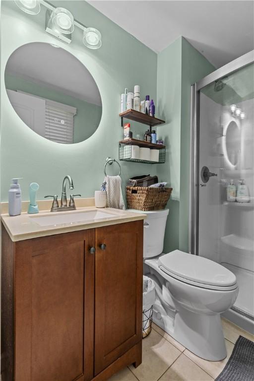 22 Green Crescent Dr, South Strabane, PA 15301 - bathroom with tile patterned flooring, toilet, a stall shower, and vanity