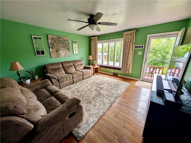 5037 Clifton Dr, Aliquippa, PA 15001 - living room featuring wood finished floors, ceiling fan, and baseboards
