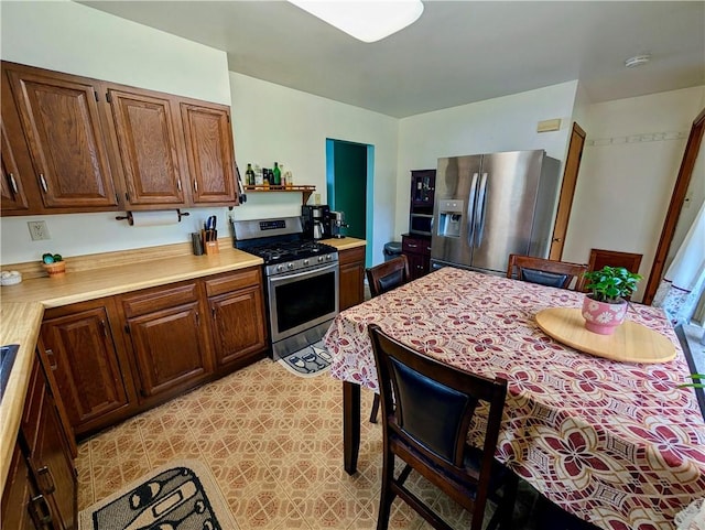 5037 Clifton Dr, Aliquippa, PA 15001 - kitchen with appliances with stainless steel finishes, light countertops, and light flooring