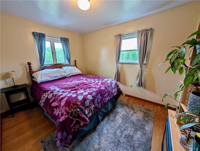 5037 Clifton Dr, Aliquippa, PA 15001 - bedroom with multiple windows, wood finished floors, and baseboards
