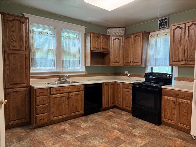 216 Center St, Slippery Rock Boro, PA 16057 - kitchen with black appliances, a sink, and brown cabinets