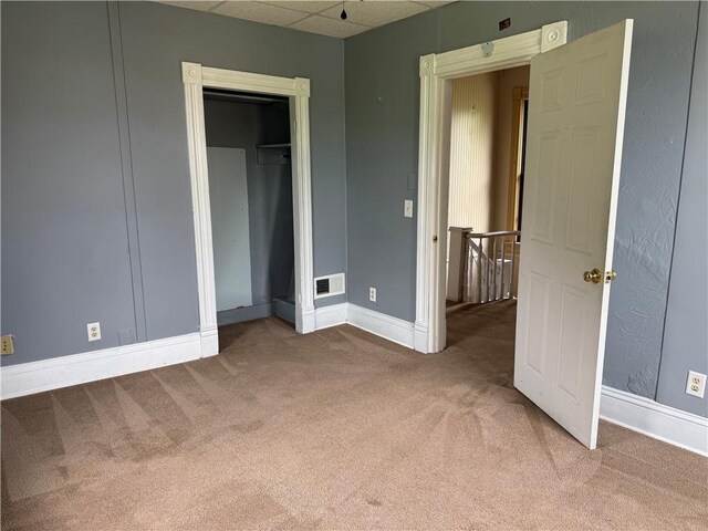 216 Center St, Slippery Rock Boro, PA 16057 - unfurnished bedroom featuring carpet flooring, a paneled ceiling, baseboards, and a closet