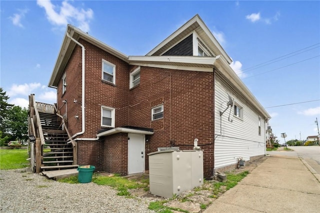 657 Grove St, City Of Greensburg, PA 15601 - view of property exterior featuring stairway and brick siding