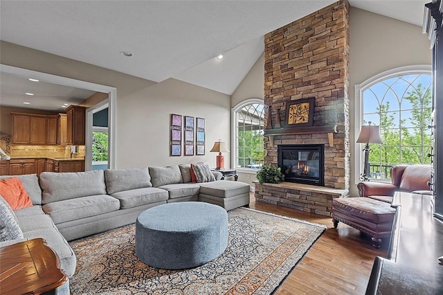 317 Buckingham Dr, Peters Twp, PA 15367 - living room with light wood-type flooring, a stone fireplace, recessed lighting, and high vaulted ceiling