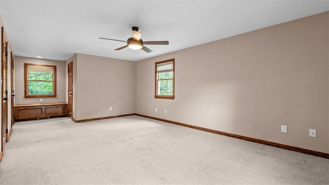 240 La Ray Dr, Center Twp But, PA 16001 - empty room with ceiling fan, light carpet, and plenty of natural light