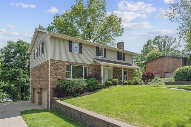 240 La Ray Dr, Center Twp But, PA 16001 - view of front of property with a chimney, an attached garage, driveway, a front yard, and brick siding