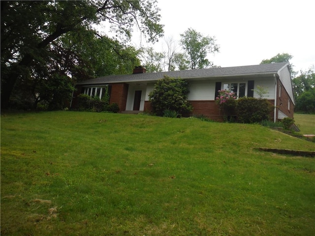 1260 Fox Chapel Rd, Fox Chapel, PA 15238 - ranch-style house with a front yard, brick siding, and a chimney