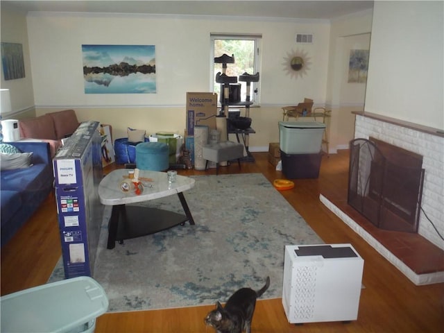 1260 Fox Chapel Rd, Fox Chapel, PA 15238 - living room with wood finished floors, a fireplace, and crown molding