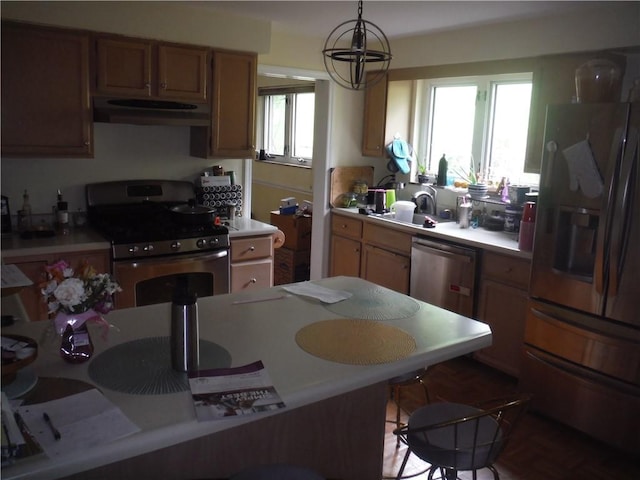 1260 Fox Chapel Rd, Fox Chapel, PA 15238 - kitchen featuring appliances with stainless steel finishes, under cabinet range hood, a sink, and light countertops