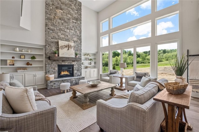304 Azalea Ln, Marshall, PA 15005 - living area featuring a high ceiling, wood finished floors, a fireplace, and built in features