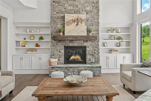 304 Azalea Ln, Marshall, PA 15005 - living area with wood finished floors, a stone fireplace, and built in shelves