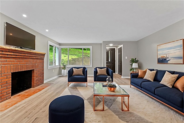100 Old Legionville Rd, Economy, PA 15005 - living room with wood finished floors, baseboards, a fireplace, and recessed lighting