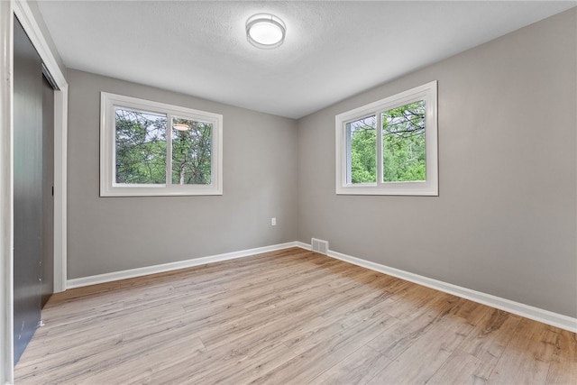 100 Old Legionville Rd, Economy, PA 15005 - unfurnished bedroom featuring a closet, baseboards, and light wood-type flooring