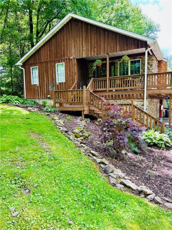 4426 Ellwood Rd, Wayne Twp Law, PA 16101 - view of front facade featuring covered porch, a front yard, and stone siding