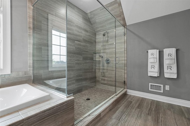 197 Wellington Cir, Peters Twp, PA 15317 - bathroom featuring a bath, a shower stall, baseboards, and wood finished floors