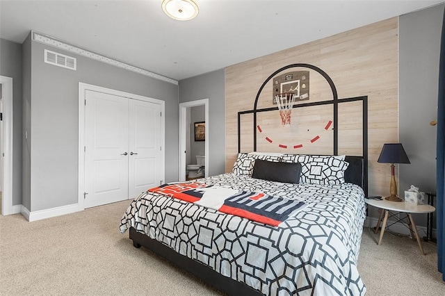 197 Wellington Cir, Peters Twp, PA 15317 - bedroom featuring carpet floors, a closet, baseboards, and wooden walls