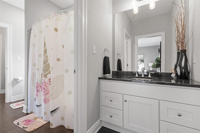 197 Wellington Cir, Peters Twp, PA 15317 - bathroom with vanity, wood finished floors, baseboards, and a shower with shower curtain