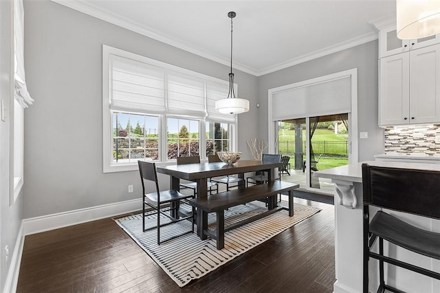 197 Wellington Cir, Peters Twp, PA 15317 - dining area with baseboards, crown molding, and dark wood-type flooring