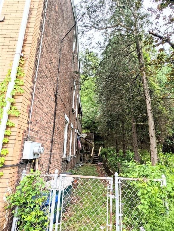 3200 Central Ave, Marshall Shadeland, PA 15212 - view of side of home with brick siding and a gate