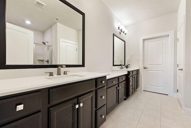 304 Spruce Ln, North Strabane, PA 15317 - bathroom with double vanity, a stall shower, and tile patterned flooring