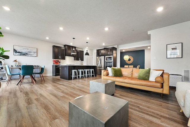 304 Spruce Ln, North Strabane, PA 15317 - living area featuring light wood-style flooring and recessed lighting