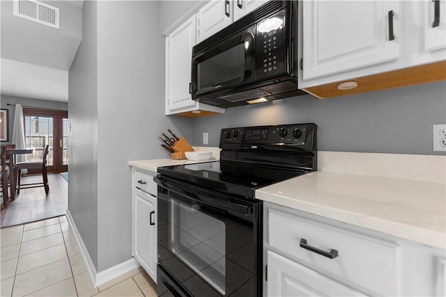 140 Jamestown Ct, Scott Twp Sal, PA 15216 - kitchen featuring black appliances, light countertops, baseboards, and light tile patterned floors