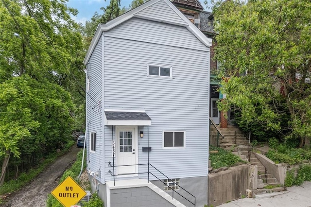 5437 Rosetta St, Garfield, PA 15206 - view of home's exterior with stairway and roof with shingles