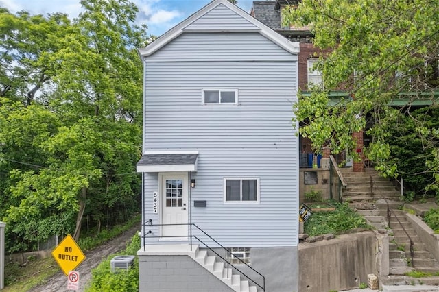 5437 Rosetta St, Garfield, PA 15206 - back of property with stairway, cooling unit, and roof with shingles