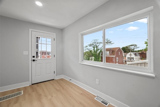 5437 Rosetta St, Garfield, PA 15206 - doorway with baseboards, wood finished floors, and recessed lighting
